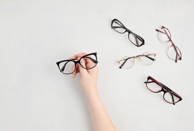 woman-hand-holding-eyeglasses-optical-store-glas-2021-09-03-21-11-08-utc-copy.jpg